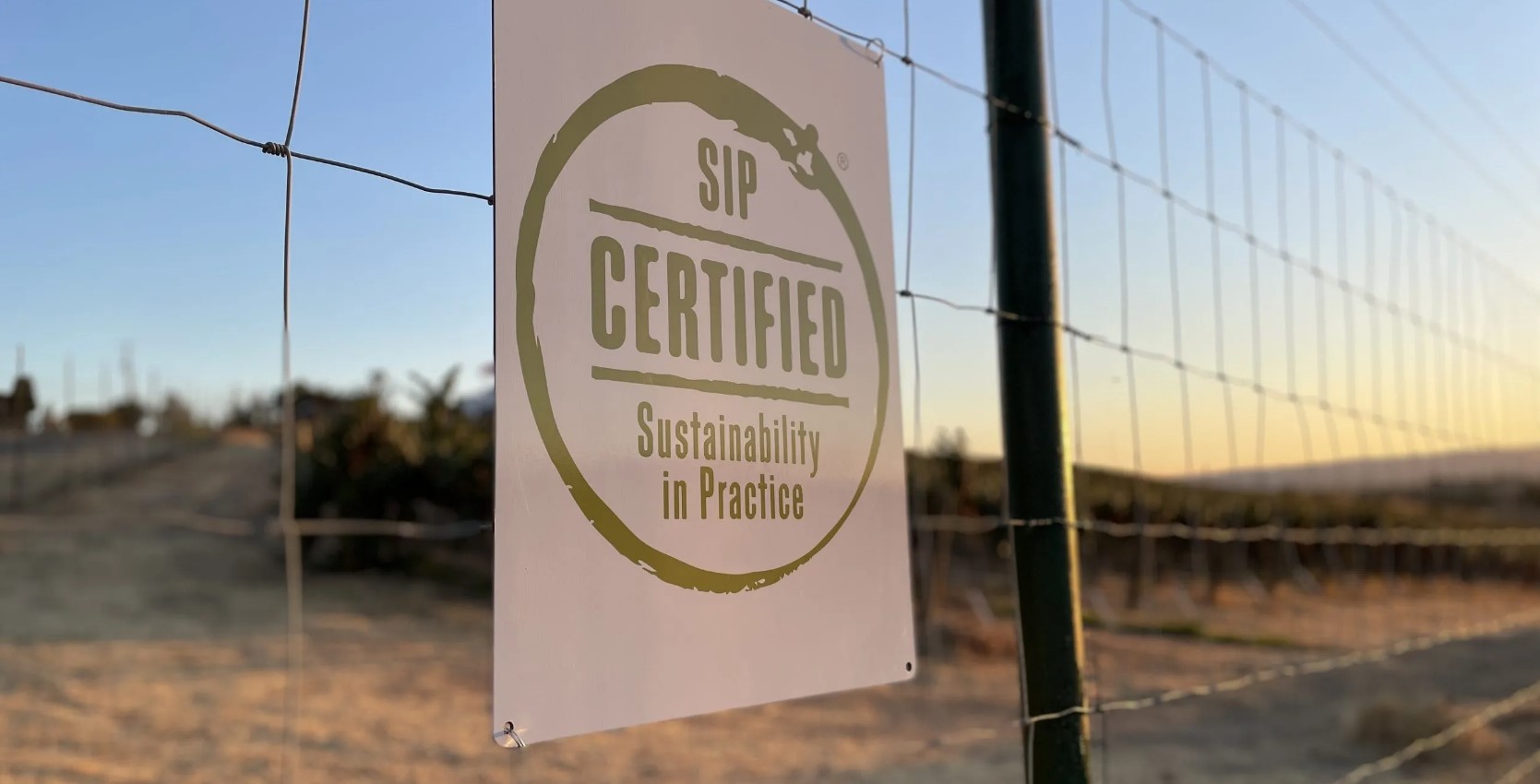 SIP Certified property sign posted on a fence at Bon Niche Cellars, San Miguel, CA